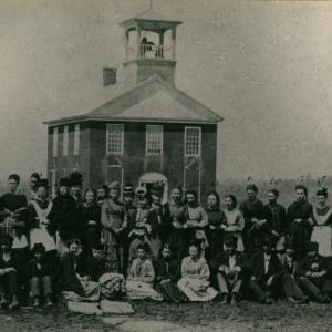 Warren Academy, unknown year. (Photo courtesy Karin Larson, WHS historian) Black and white photo of students in front of a school